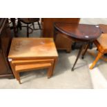 A RETRO NEST OF THREE TABLES AND DEMI-LUNE HALL TABLE