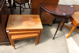 A RETRO NEST OF THREE TABLES AND DEMI-LUNE HALL TABLE