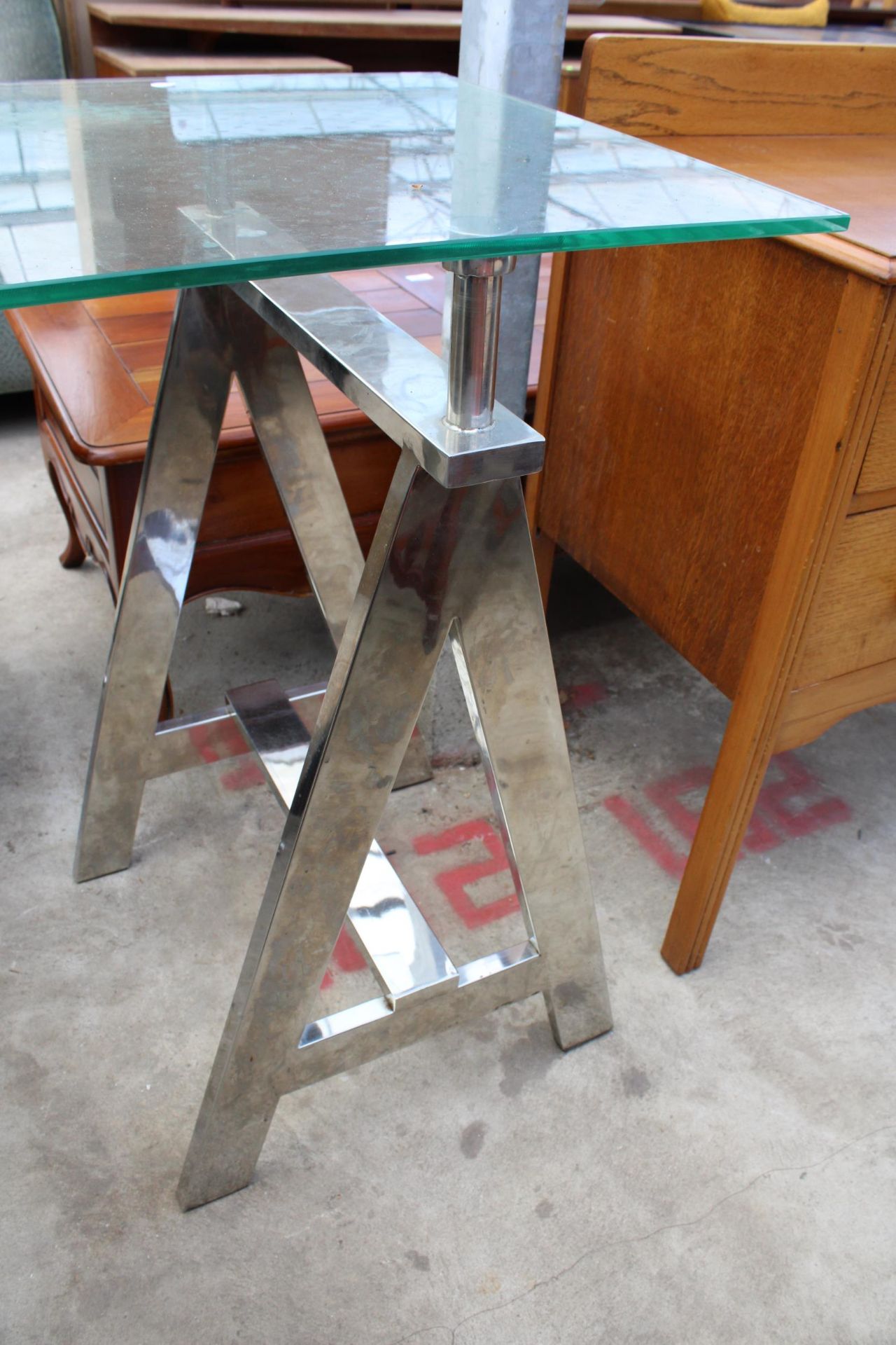 A RETRO CONSOLE TABLE WITH GLASS TOP ON POLISHED CHROME TRESTLE STYLE LEGS, 59" X 20" - Image 2 of 2