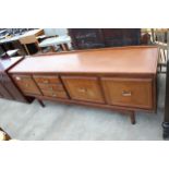 A RETRO TEAK SIDEBOARD ENCLOSING THREE DRAWERS AND THREE CUPBOARDS, 78" WIDE