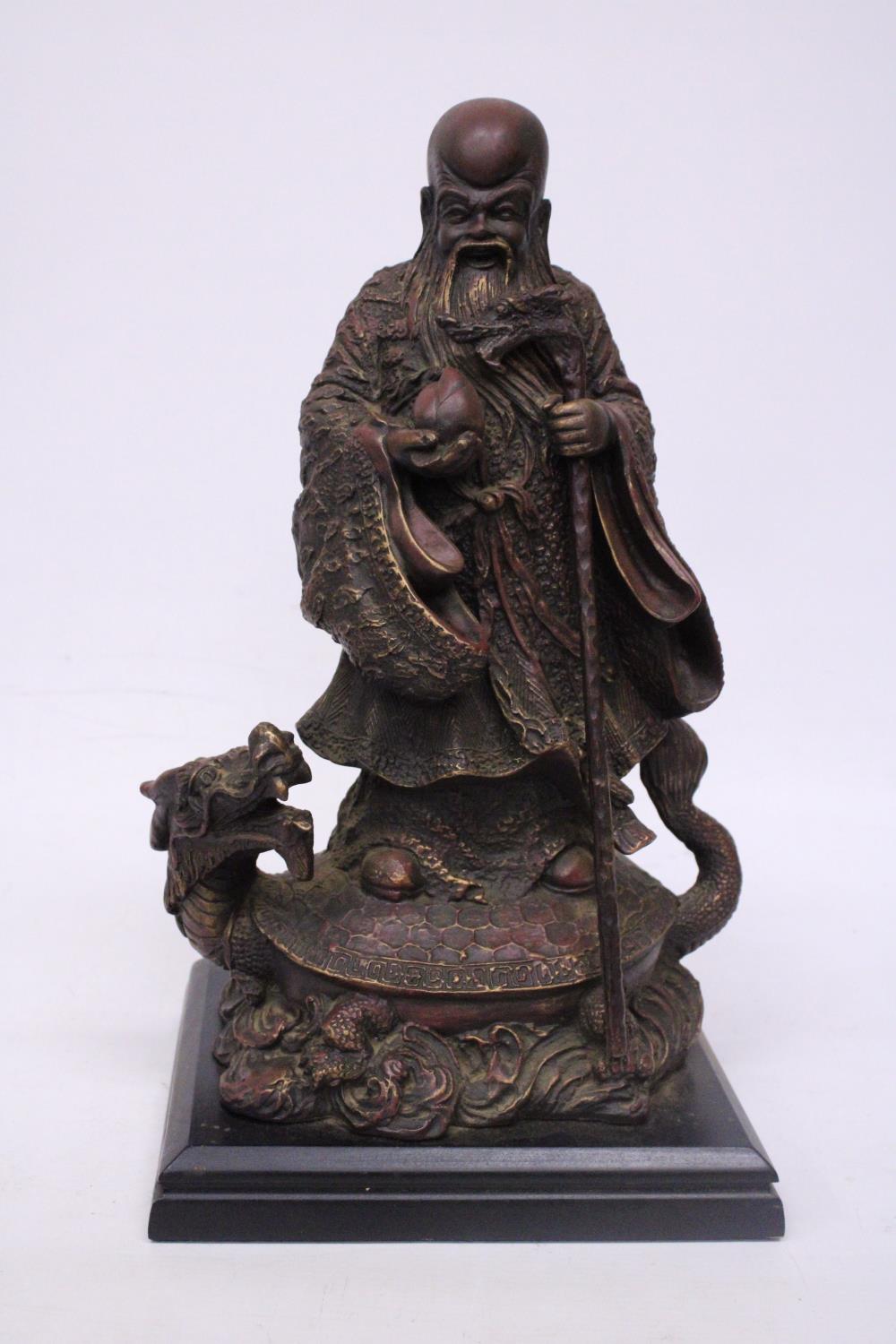 AN AUSTIN PRODUCTIONS SCULPTURE SHOULAO "GOD OF LONGEVITY" STATUE MODELLED AS SHOU LAO POSED