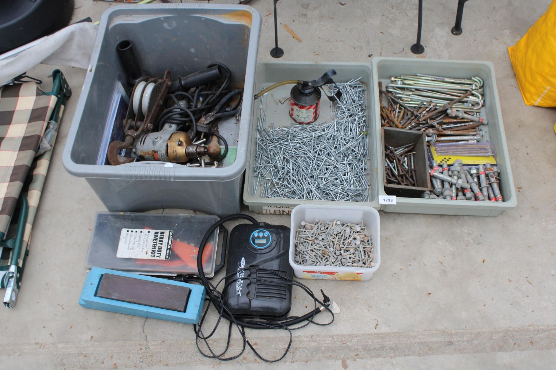 AN ASSORTMENT OF TOOLS AND HARDWARE TO INCLUDE NAILS, A DRILL AND A PULLEY HOOK ETC