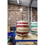A LARGE STONEWARE B.BRANDY KEG WITH TAPS CONVERTED TO A LAMP. APPROX HEIGHT OF BARREL 32.5CM.