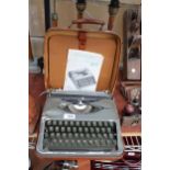 A HERMES BABY TYPEWRITER WITH CARRY CASE