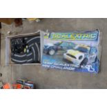 A SCALEXTRIC SET COMPLETE WITH TWO CARS