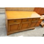 A MODERN STAG SIDEBOARD ENCLOSING THREE DRAWERS AND THREE CUPBOARDS, 52" WIDE