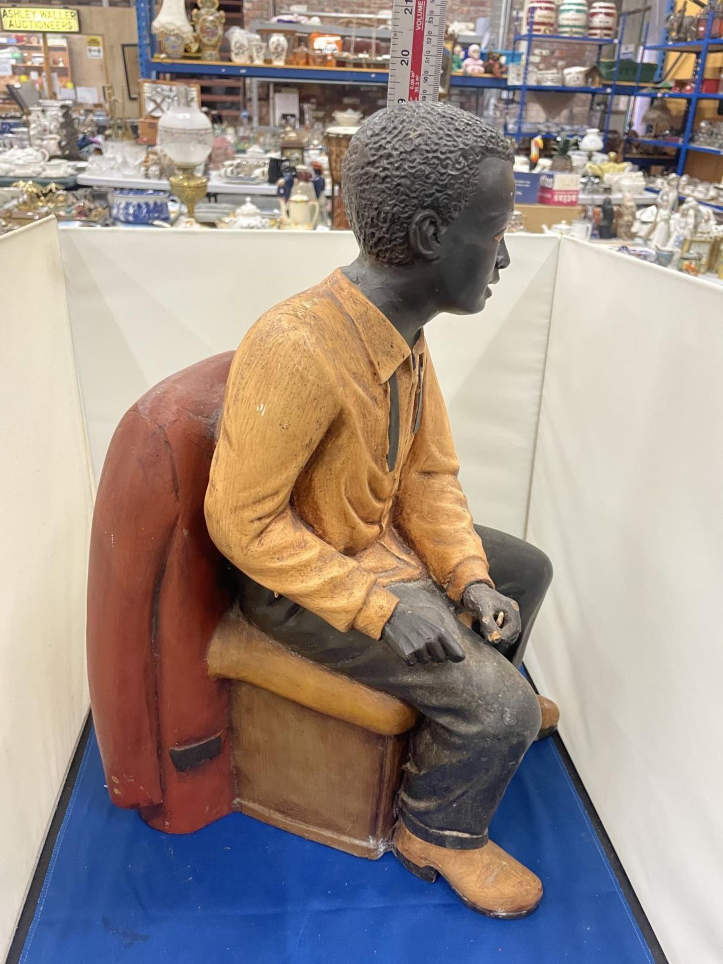A LARG FIGURE OF A MAN SITTING IN A CHAIR - Image 7 of 8