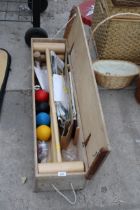 A BELIEVED COMPLETE LAWN CROQUET SET WITH WOODEN CARRY BOX