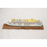 A HEAVY, SOLID, OCEAN LINER ON WOODEN STAND, 'OCEANA', LENGTH 27CM, HEIGHT 6CM