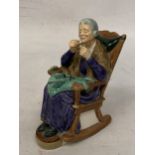 A ROYAL DOULTON FIGURINE "A STITCH IN TIME" HN 2352