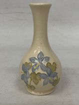 A MOORCROFT MOULDED RAISED DESIGN "CAMPANULA" VASE ON CREAM BACKGROUND