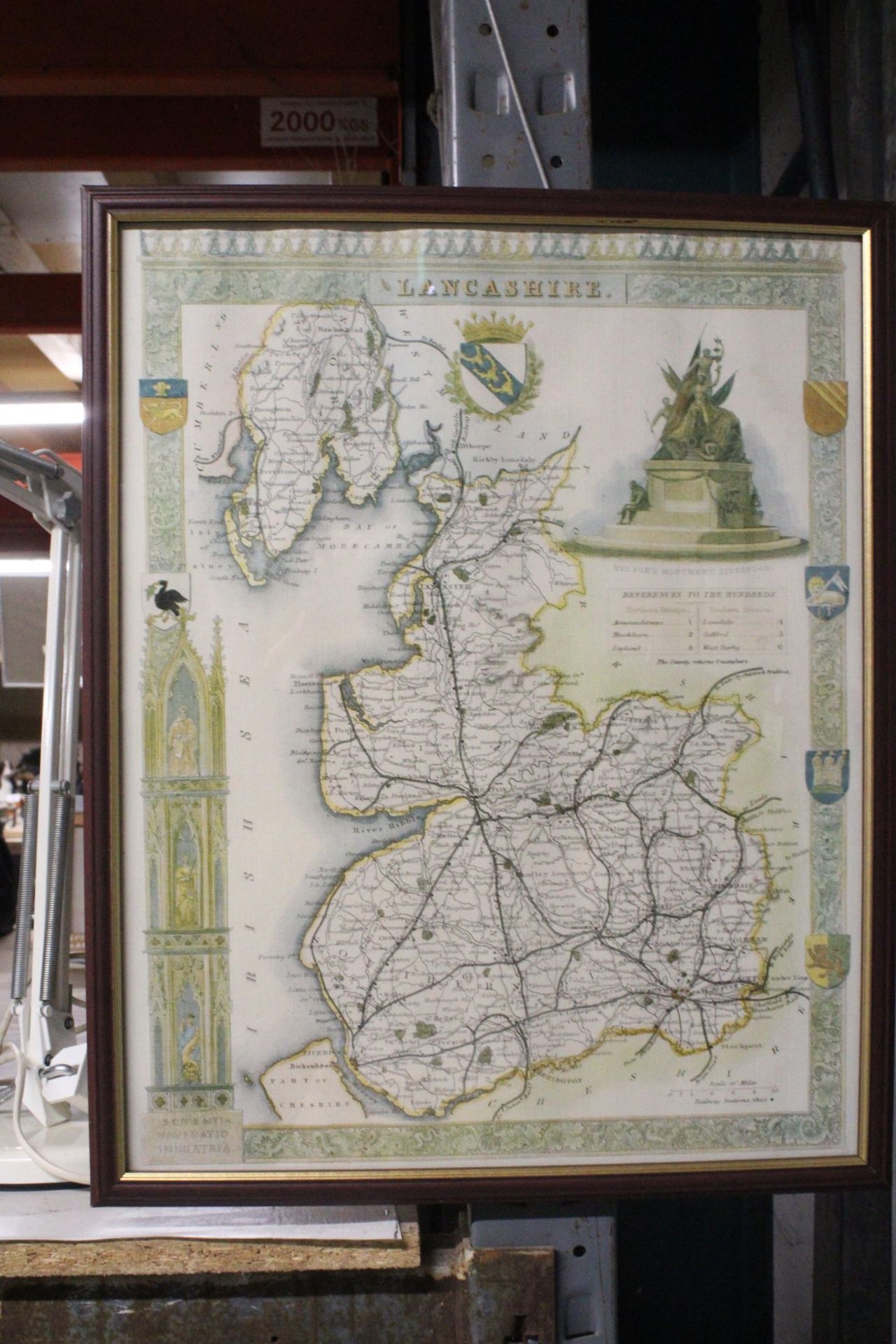 A FRAMED PRINT OF A MAP OF LANCASHIRE