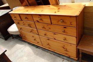 A MODERN PINE CHEST OF FOUR SHORT AND SIX LONG DRAWERS, 62" WIDE