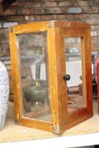 A VINTAGE WOOD AND GLASS DISPLAY CABINET