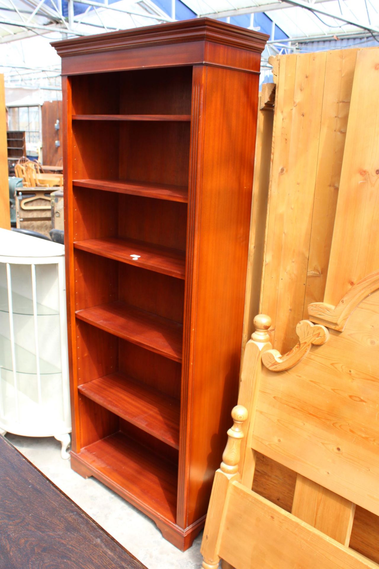 A MODERN MAHOGANY SIX TIER OPEN BOOKCASE, 33" WIDE