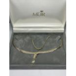 A 9 CARAT GOLD NECKLACE IN A PRESENTATION BOX