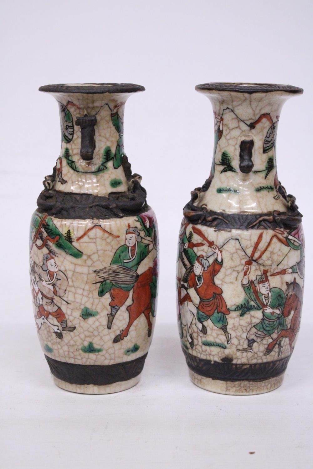 A PAIR OF CHINESE CRACKLE GLAZED VASES WITH WARRIOR SCENES - 18 CM (H) - MARK TO BASE - Image 4 of 6