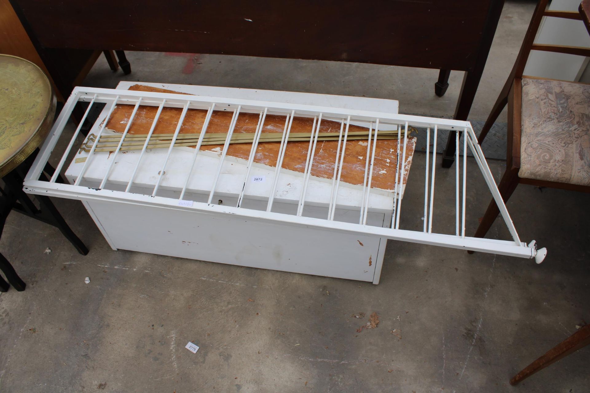 A WHITE PAINTED LADDERAX DOCUMENT UNIT, TWO METAL STANDS AND FOUR BRASS RODS