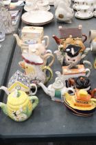 A LARGE QUANTITY OF NOVELTY TEAPOTS TO INCLUDE SHORTER AND SONS LTD, WADE, THE VILLAGE BY ANNIE ROWE