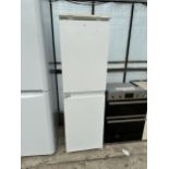 A TALL UPRIGHT INTERGRATED FRIDGE FREEZER