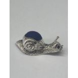 A MARKED SILVER PIN CUSHION IN THE FORM OF A SNAIL