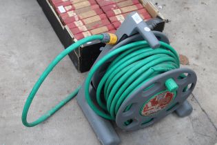 A HOSE REEL WITH HOSE PIPE