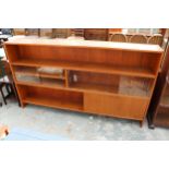 A RETRO TEAK OPEN BOOKCASE WITH FOUR SLIDING GLASS DOORS AND CUPBOARD, 77" WIDE