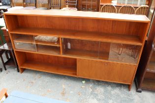 A RETRO TEAK OPEN BOOKCASE WITH FOUR SLIDING GLASS DOORS AND CUPBOARD, 77" WIDE