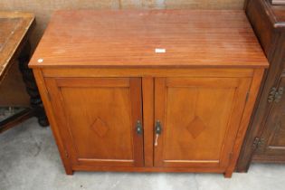 A TWO DOOR TEAK CABINET 36" WIDE