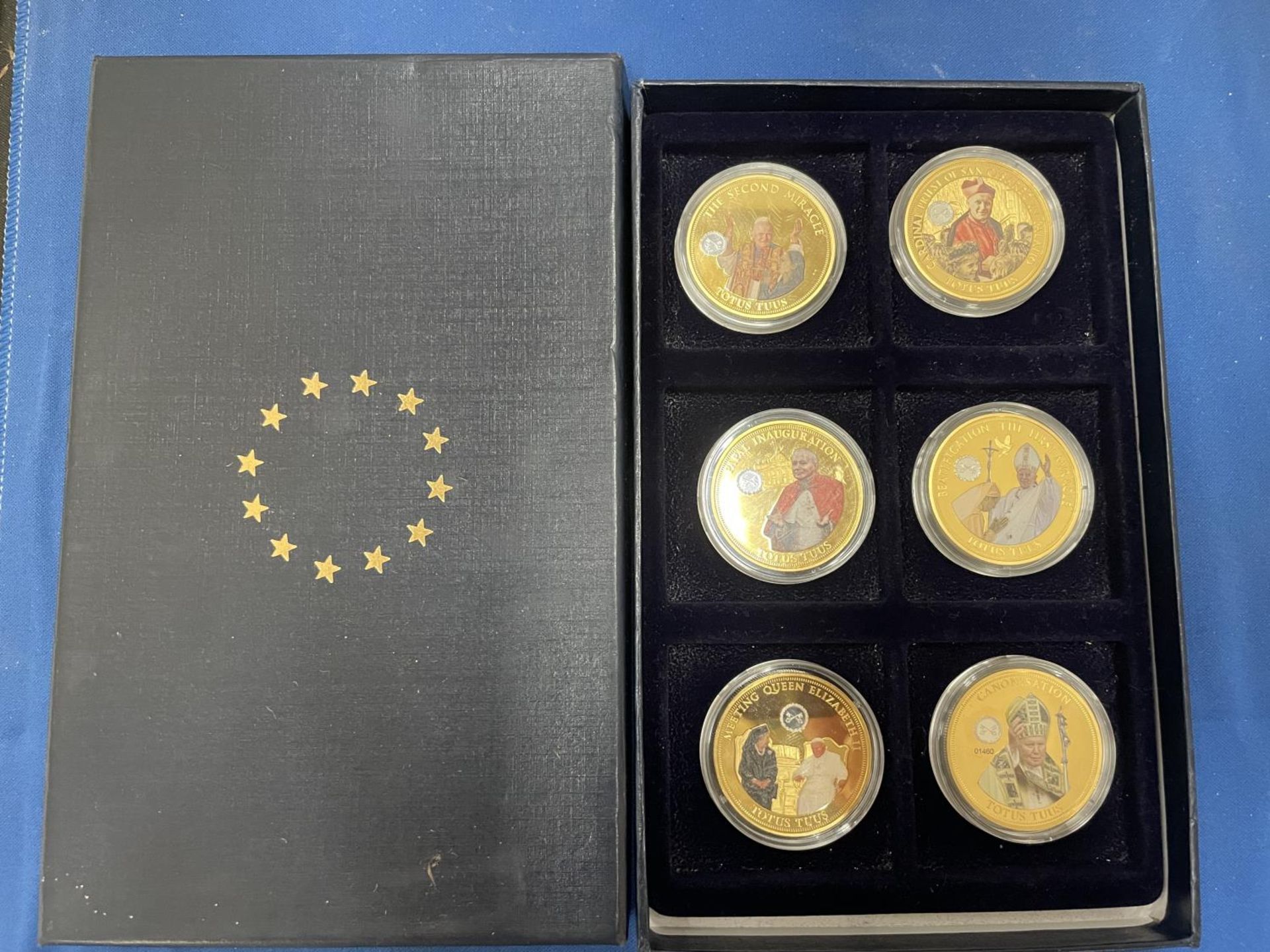 A SET OF SIX LIMITED EDITION GOLD PLATED COINS DEPICTING POPE IN 2014 BY THE EU COMMISSION AND THE