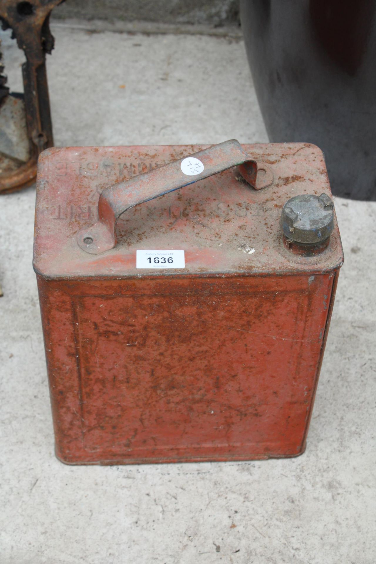 A VINTAGE METAL FUEL CAN WITH BRASS CAP
