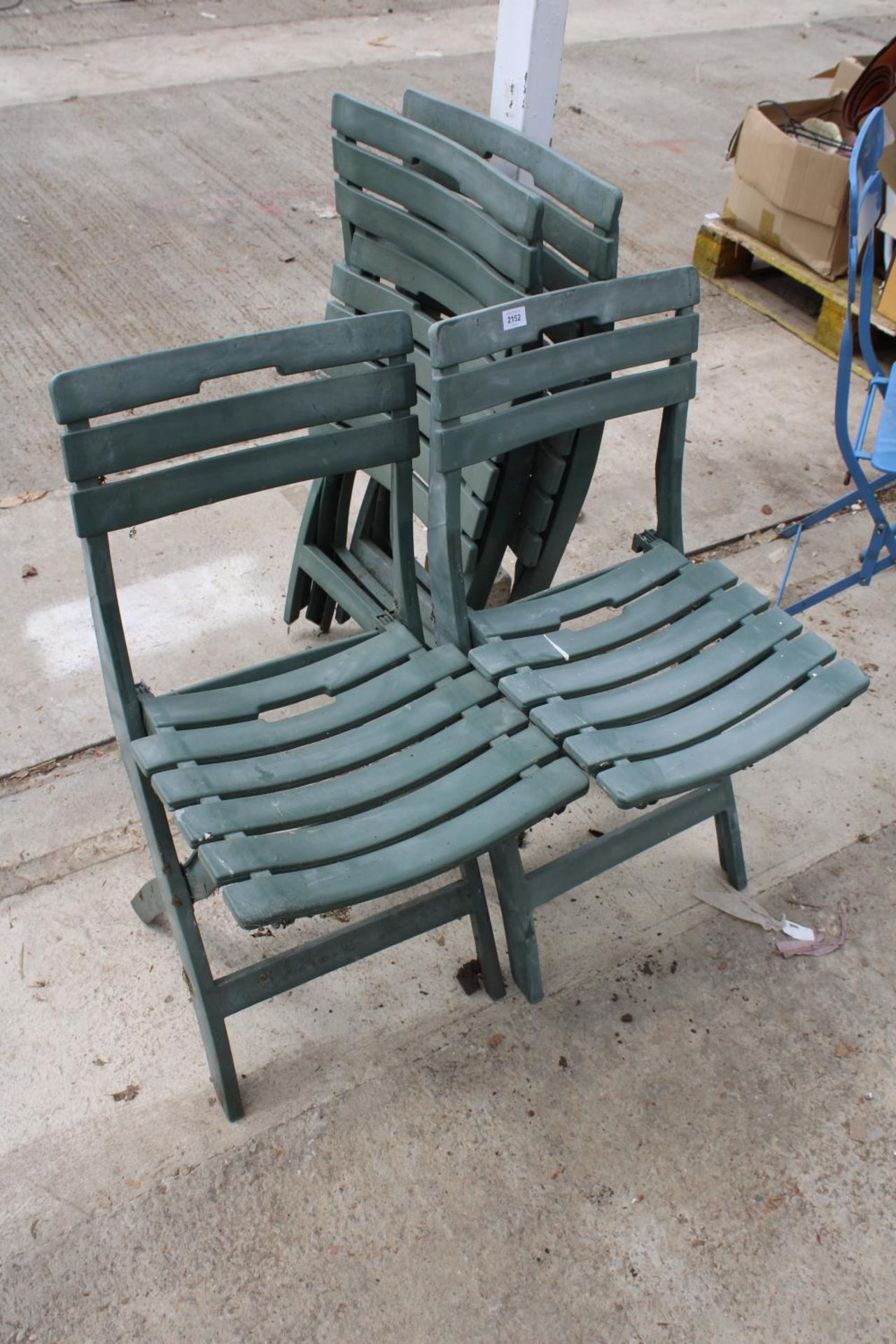 A SET OF FOUR PLASTIC FOLDING GARDEN CHAIRS