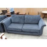 A MODERN SLATE GREY THREE SEATER SETTEE WITH POLISHED CHROME BUTTONED ARMS AND LEGS