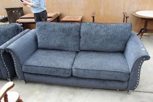 A MODERN SLATE GREY THREE SEATER SETTEE WITH POLISHED CHROME BUTTONED ARMS AND LEGS