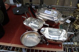 A SILVER PLATED TEASET COMPRISING OF A TEAPOT, SUGAR BOWL AND MILK JUG AND A FURTHER SILVER PLATE