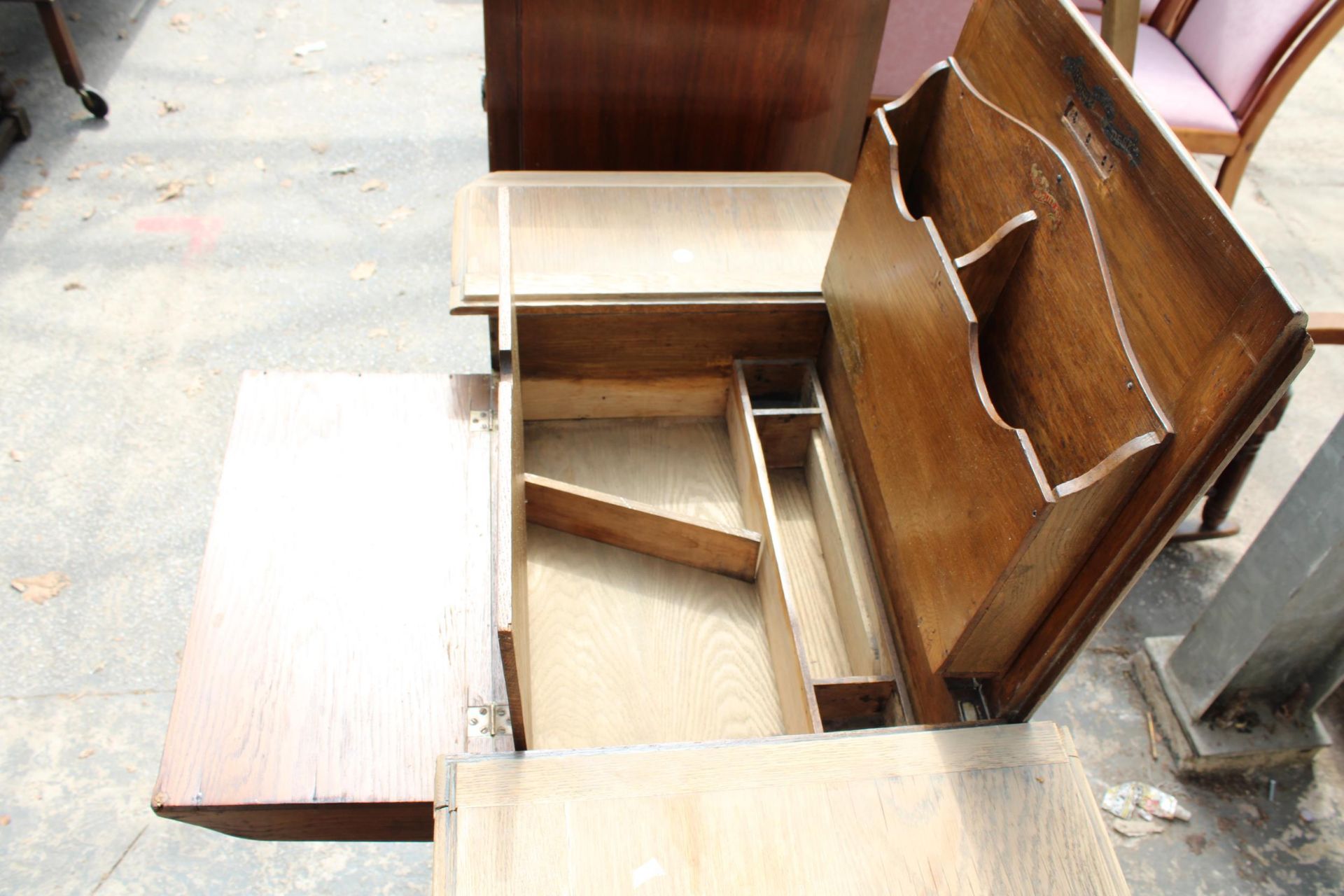 AN EARLY 20TH CENTURY OAK 'THE BRITISHER DESK' WITH FOLD-OUT WRITING AND STORAGE SECTIONS, 36" WIDE - Image 5 of 6