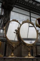 A PAIR OF DECORATIVE BRASS SWING FRAME DRESSING TABLE MIRRORS