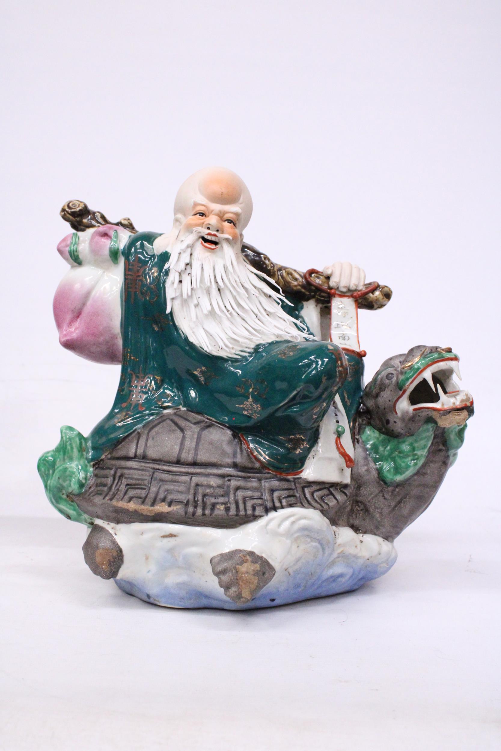 A CHINESE PORCELAIN WISE MAN RIDING A DRAGON TURTLE - Image 2 of 7