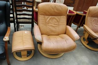 A STRESSLESS EKORNES TANNED LEATHER SWIVEL RECLINER WITH STOOL