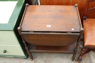 A MID 20TH CENTURY OAK TWO TIER DROP-LEAF TROLLEY