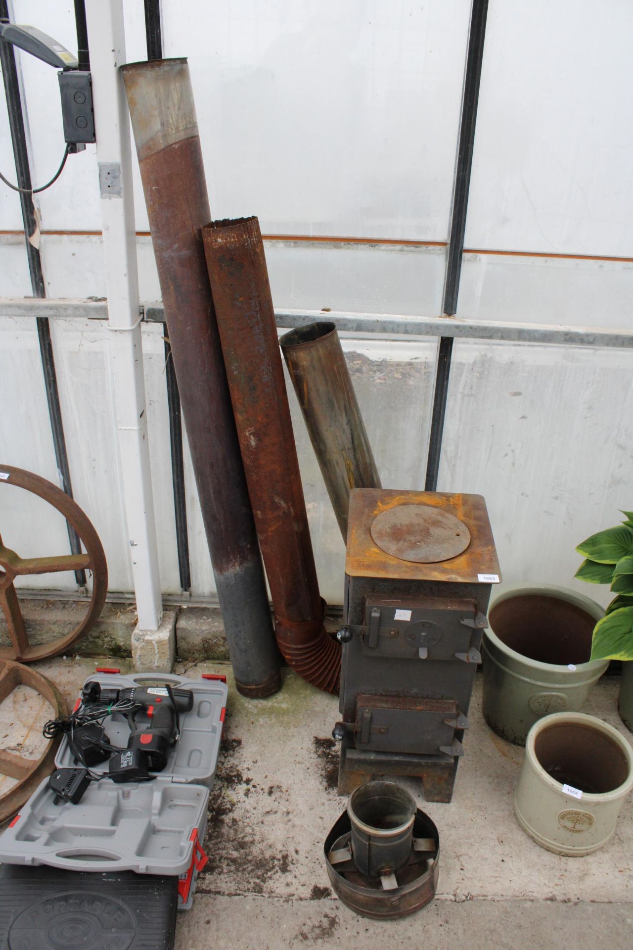 A VINTAGE STOVE WITH FLU PIPE