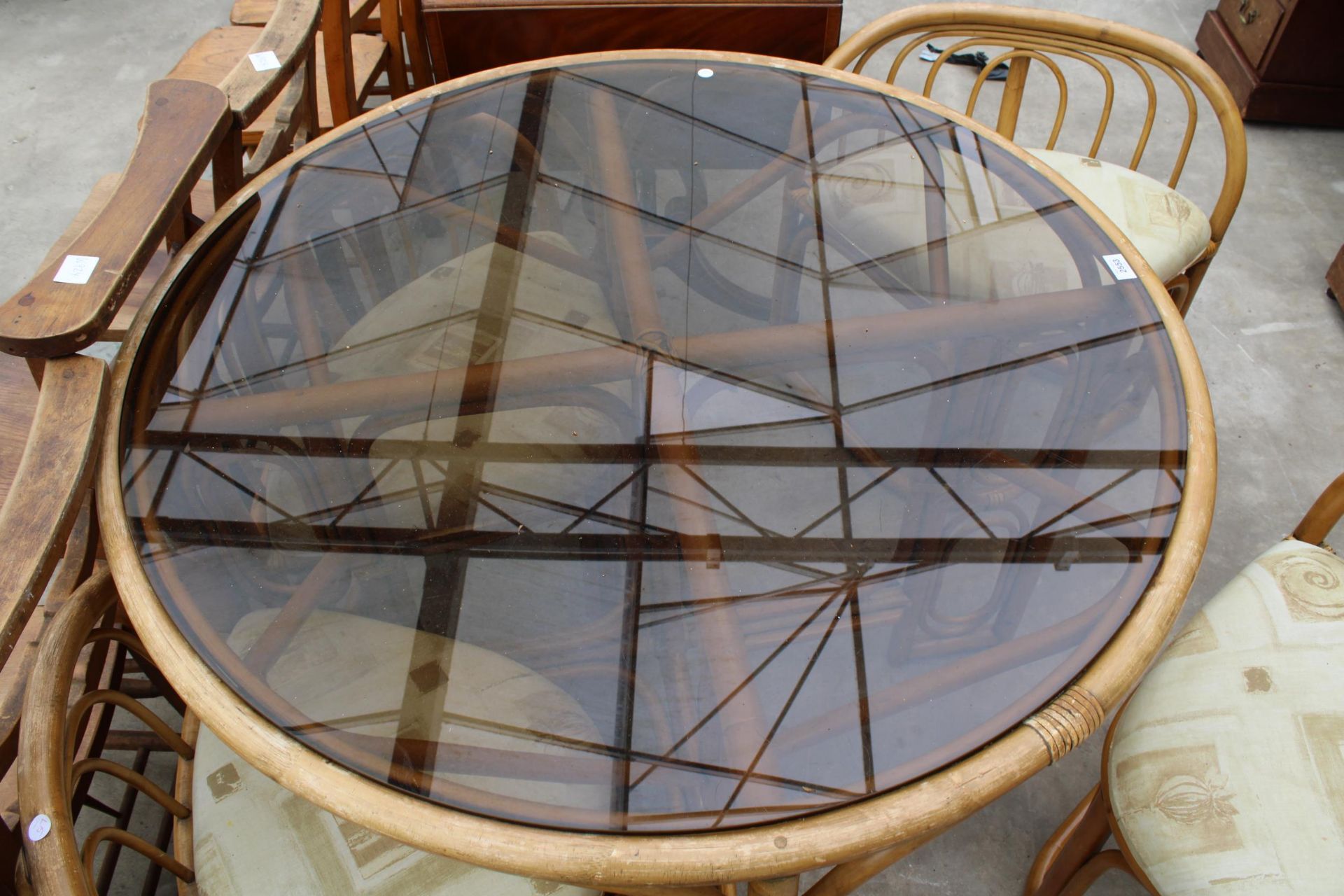 A MODERN 41" DIAMETER BAMBOO AND WICKER DINING TABLE WITH SMOKED GLASS TOP AND FOUR DINING CHAIRS - Image 6 of 6
