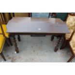 AN OAK EARLY 20TH CENTURY EXTENDING DINING TABLE ON BARLEY TWIST LEGS 52" X 24" (TWO LEAVES 13"