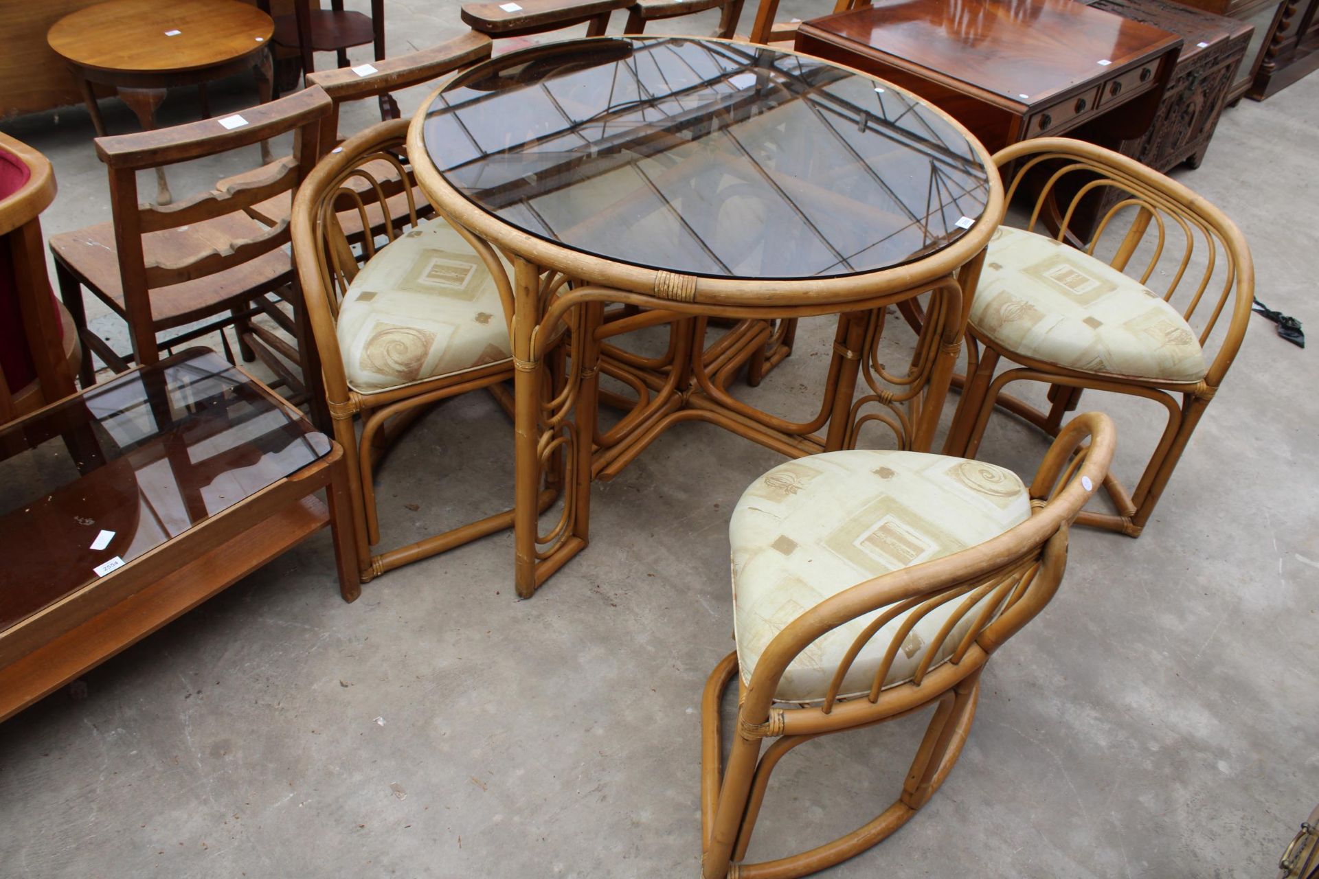 A MODERN 41" DIAMETER BAMBOO AND WICKER DINING TABLE WITH SMOKED GLASS TOP AND FOUR DINING CHAIRS - Image 3 of 6
