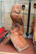A TERRACOTTA OWL ROOF FINIAL
