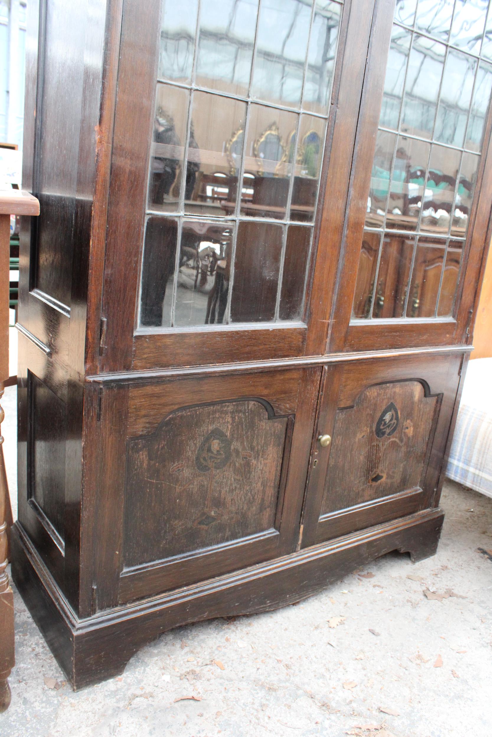 AN OAK ART NOUVEAU GLAZED AND LEADED TWO DOOR DISPLAY CABINET WITH CUPBOARDS TO BASE, 41" WIDE, - Image 3 of 6