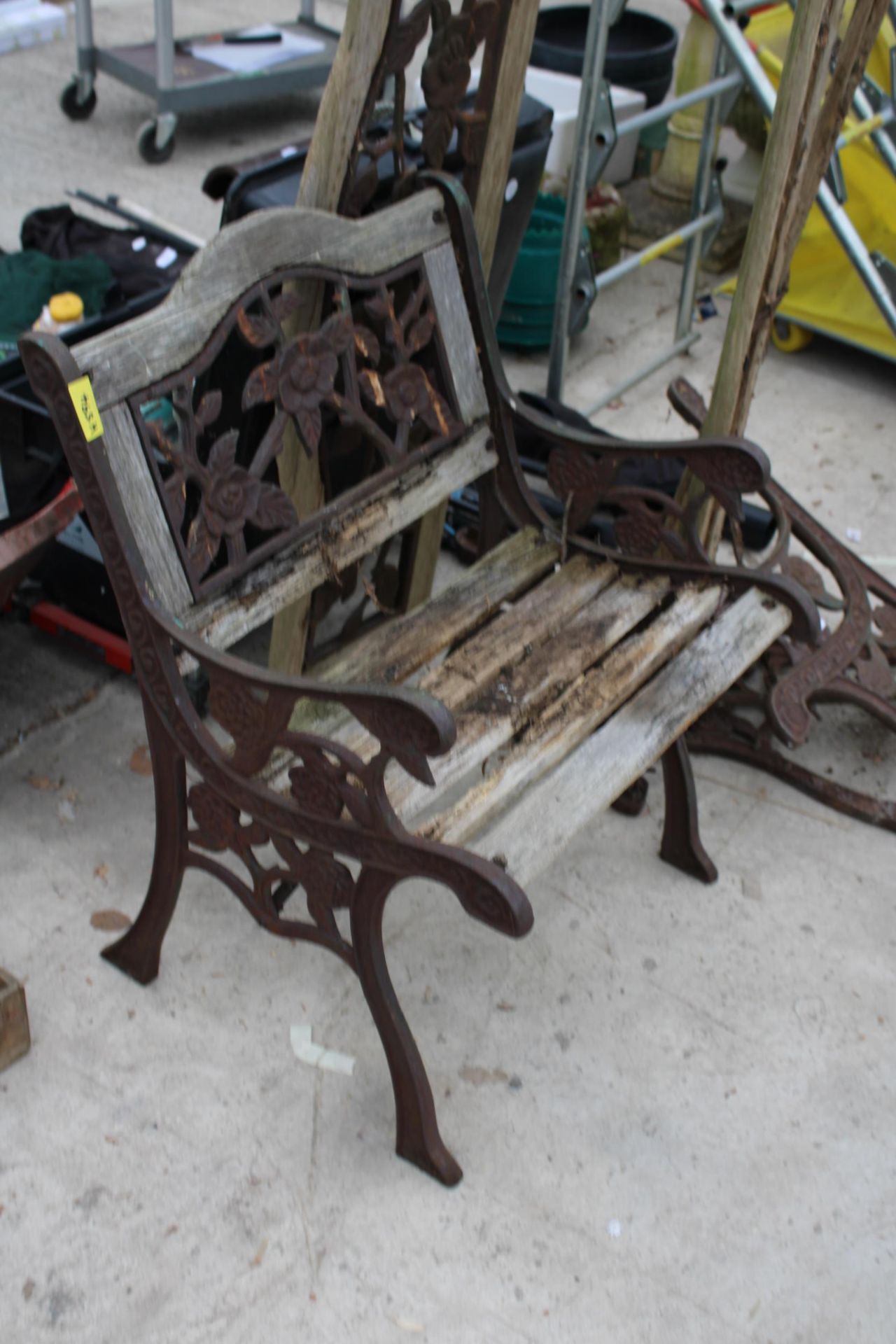 A WOODEN SLATTED GARDEN CHAIR AND BENCH BOTH FOR RESTORATION AND WITH CAST ENDS AND BACK - Image 2 of 2