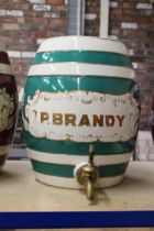 A LARGE STONEWARE P.BRANDY KEG WITH TAP. APPROX HEIGHT 32CM.
