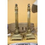 A PAIR OF HEAVY BRASS PEDESTAL ELECTRIC CANDLE STICKS LAMPS - APPROXIMATELY 47CM HIGH