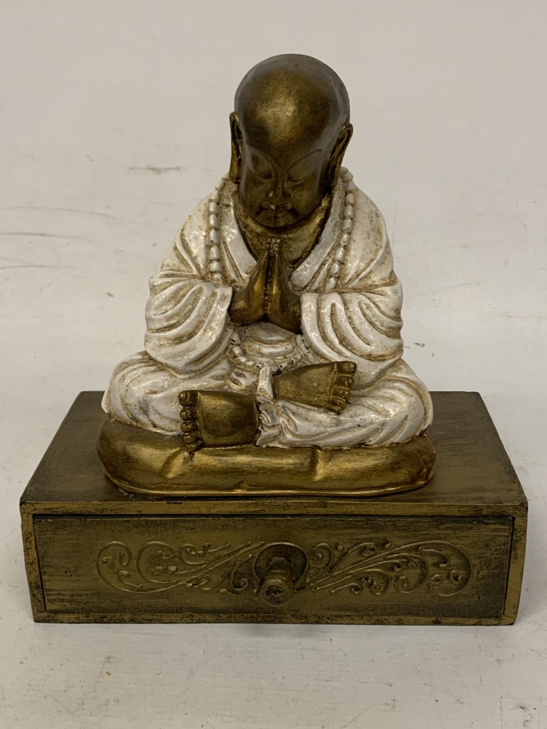A CREAM/WHITE BUDDHA JEWELLERY BOX